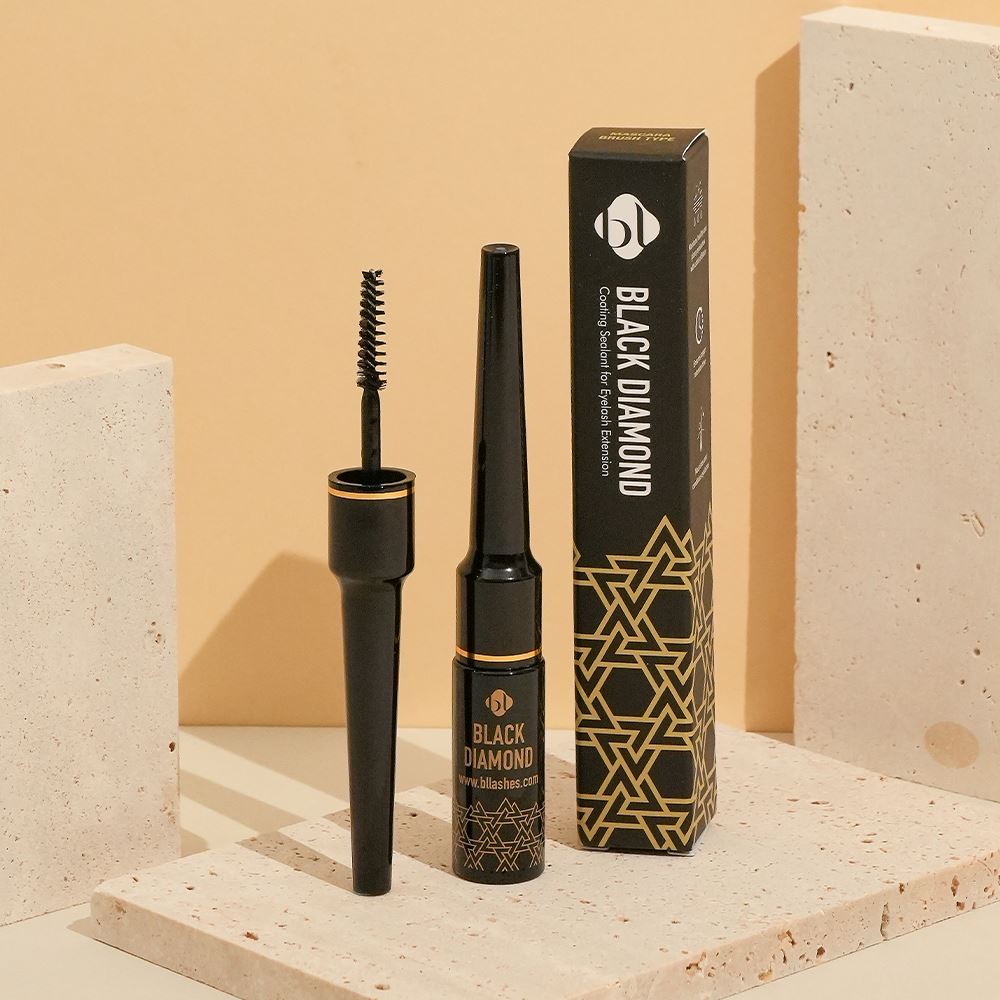 BL Lashes Black Diamond Coating Sealant bottle, opened mascara wand applicator, and its packaging box displayed on textured stone blocks.