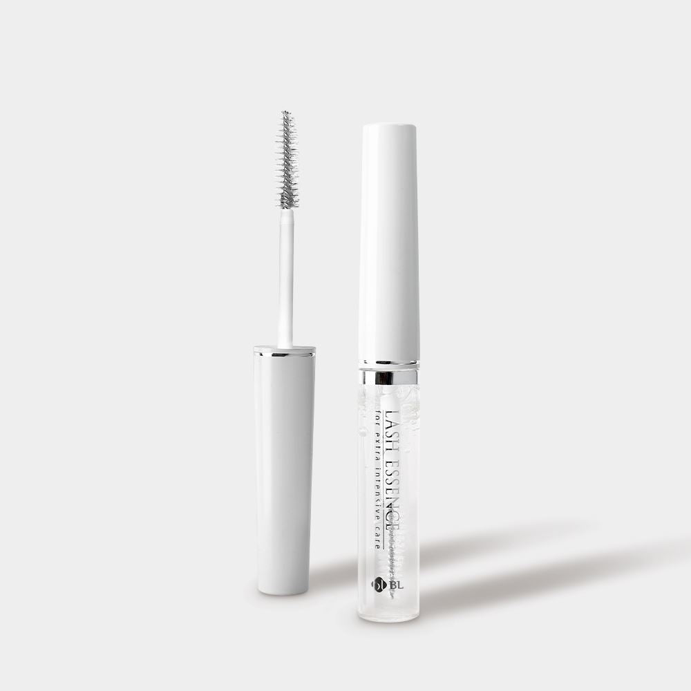 Front view of BL Lashes Lash Essence clear tube next to its opened wand applicator.