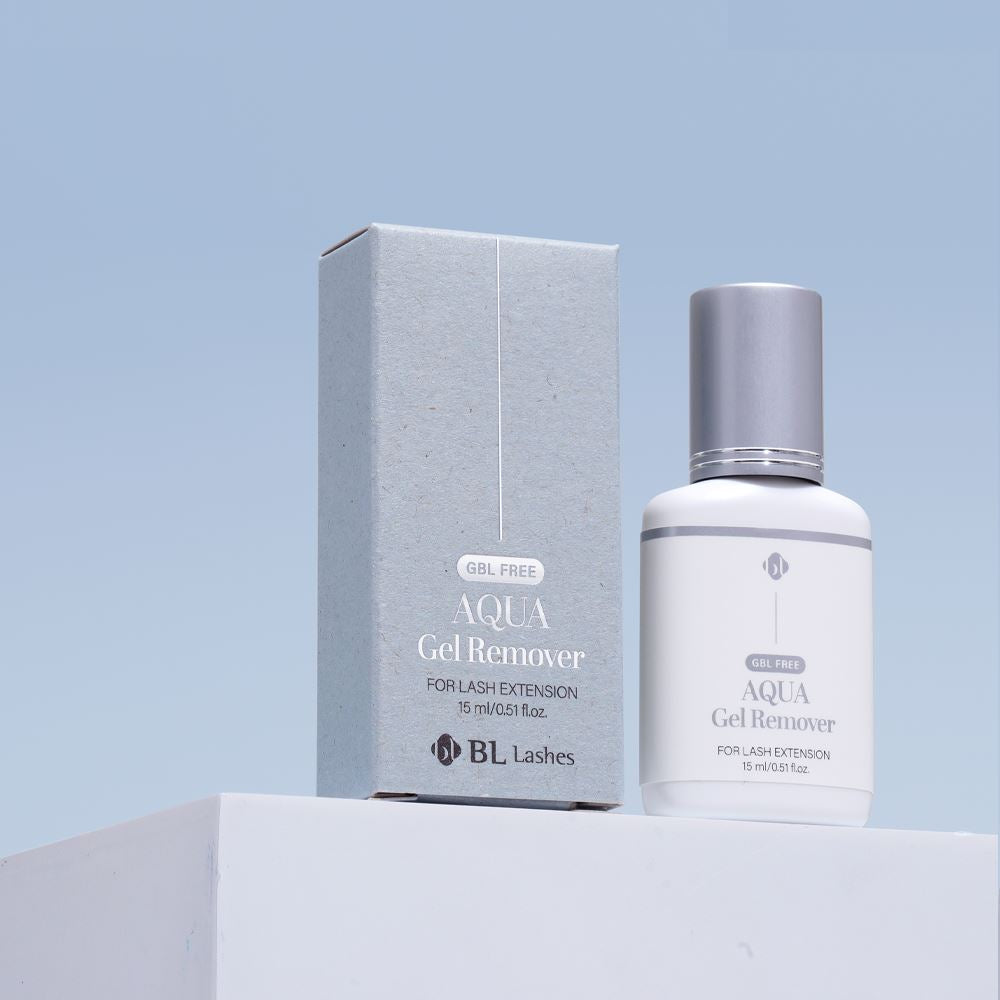 BL Lashes Aqua Gel Remover 15ml bottle with a silver cap displayed next to its packaging box on a white block against a light blue background.